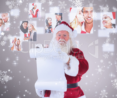 Composite image of father christmas holds a list