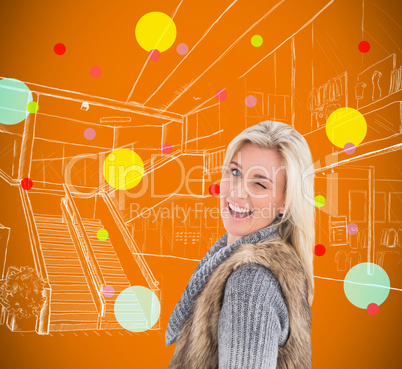 Composite image of blonde in winter clothes smiling