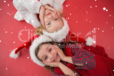 Composite image of festive little girls smiling at camera