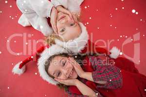 Composite image of festive little girls smiling at camera