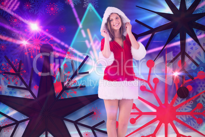 Composite image of pretty santa girl smiling at camera