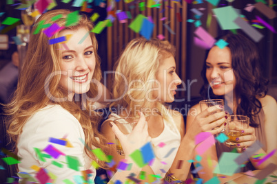 Composite image of pretty friends having a drink together