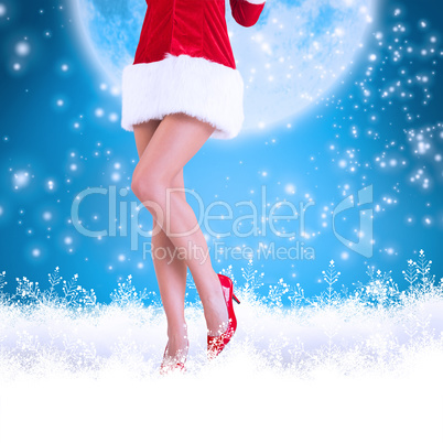 Composite image of lower half of sexy santa girl