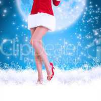 Composite image of lower half of sexy santa girl
