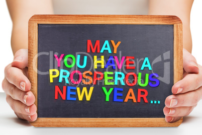 Composite image of females hands showing black board