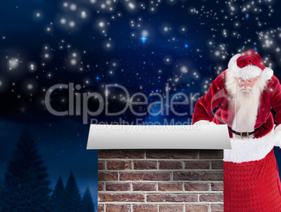 Composite image of santa looks in his bag