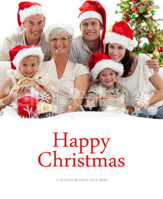 Composite image of children sitting with their family holding ch