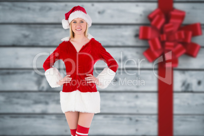 Composite image of festive blonde smiling at camera