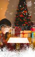Composite image of little girl opening a glowing christmas gift