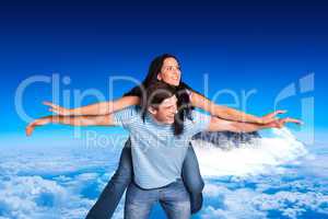 Composite image of young man giving girlfriend a piggyback ride