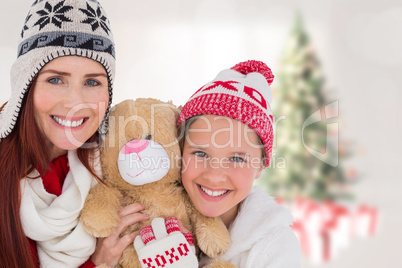 Composite image of mother and daughter with teddy