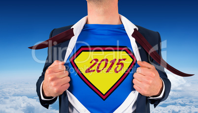 Composite image of businessman opening shirt in superhero style