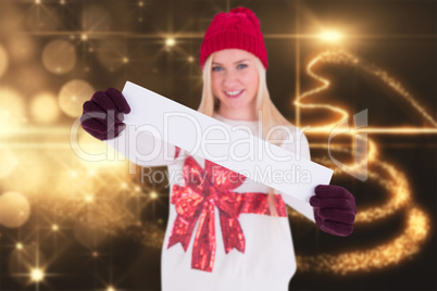 Composite image of festive blonde showing a blank banner