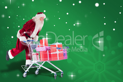 Composite image of santa pushes a shopping cart