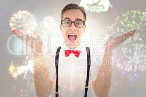 Composite image of geeky young hipster smiling at camera