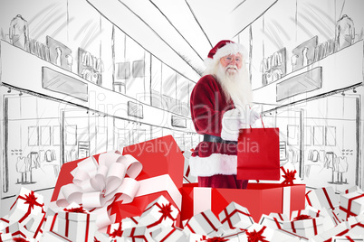 Composite image of santa standing in large gift