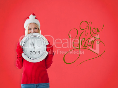 Composite image of happy festive blonde with clock