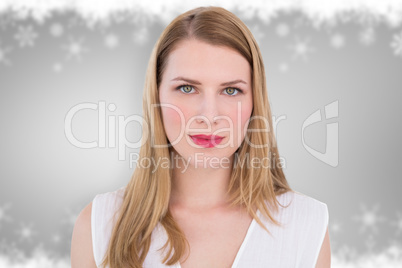 Composite image of portrait of a serious blonde woman looking at