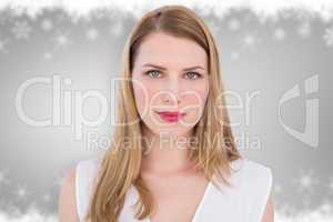 Composite image of portrait of a serious blonde woman looking at