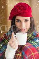 Composite image of brunette with cover holding mug