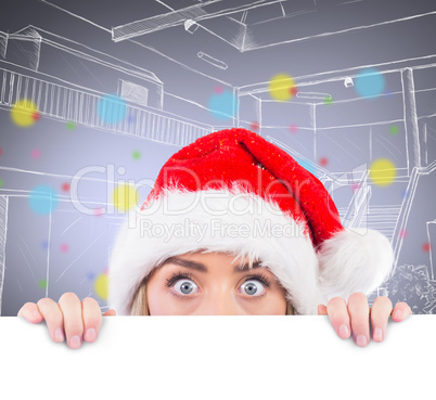 Composite image of festive blonde showing large poster