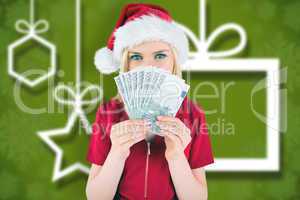 Composite image of festive blonde in red dress showing her cash