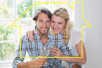 Composite image of cute smiling couple enjoying white wine toget