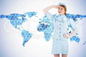 Composite image of pretty air hostess looking up
