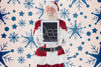 Composite image of santa presents a tablet pc