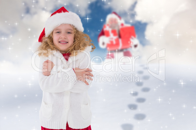 Composite image of festive little girl smiling at camera