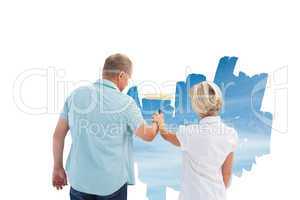 Composite image of happy older couple painting a sky