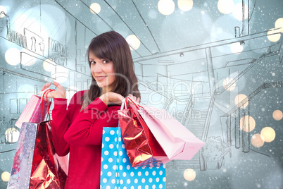 Composite image of smiling brunette holding shopping bags
