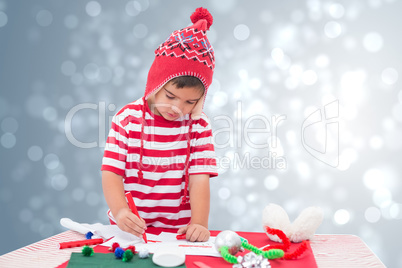 Composite image of cute boy drawing