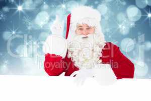 Composite image of smiling santa claus doing a gesture