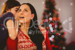 Composite image of daughter telling her mother a christmas secre
