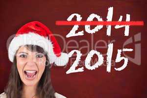 Composite image of young woman in santa hat yelling