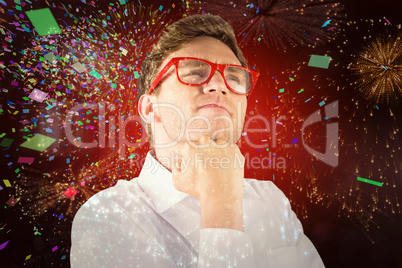 Composite image of young geeky businessman with hand on chin