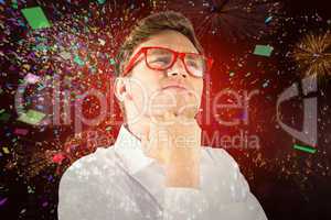 Composite image of young geeky businessman with hand on chin