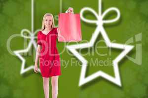 Composite image of pretty blonde in red dress holding shopping b