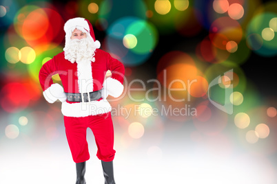 Composite image of portrait of santa claus with hands on hips