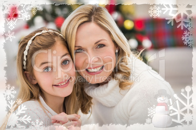 Composite image of festive mother and daughter beside christmas