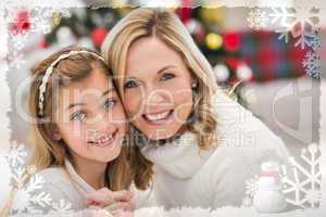 Composite image of festive mother and daughter beside christmas