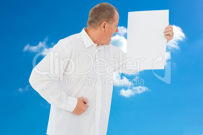 Composite image of angry man shouting at piece of paper