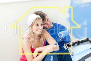 Composite image of affectionate couple painting a room