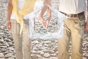 Composite image of happy senior couple touching hands