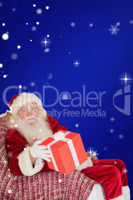 Composite image of father christmas offering a red gift