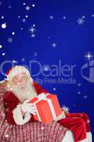Composite image of father christmas offering a red gift