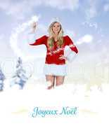 Composite image of pretty girl in santa outfit holding hand up