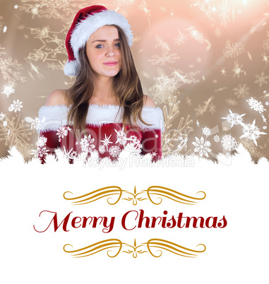 Composite image of sexy santa girl smiling at camera