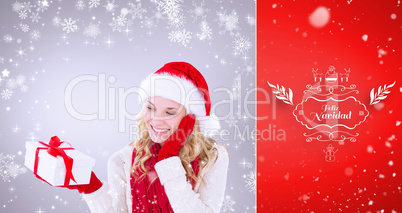 Composite image of happy festive blonde with gift